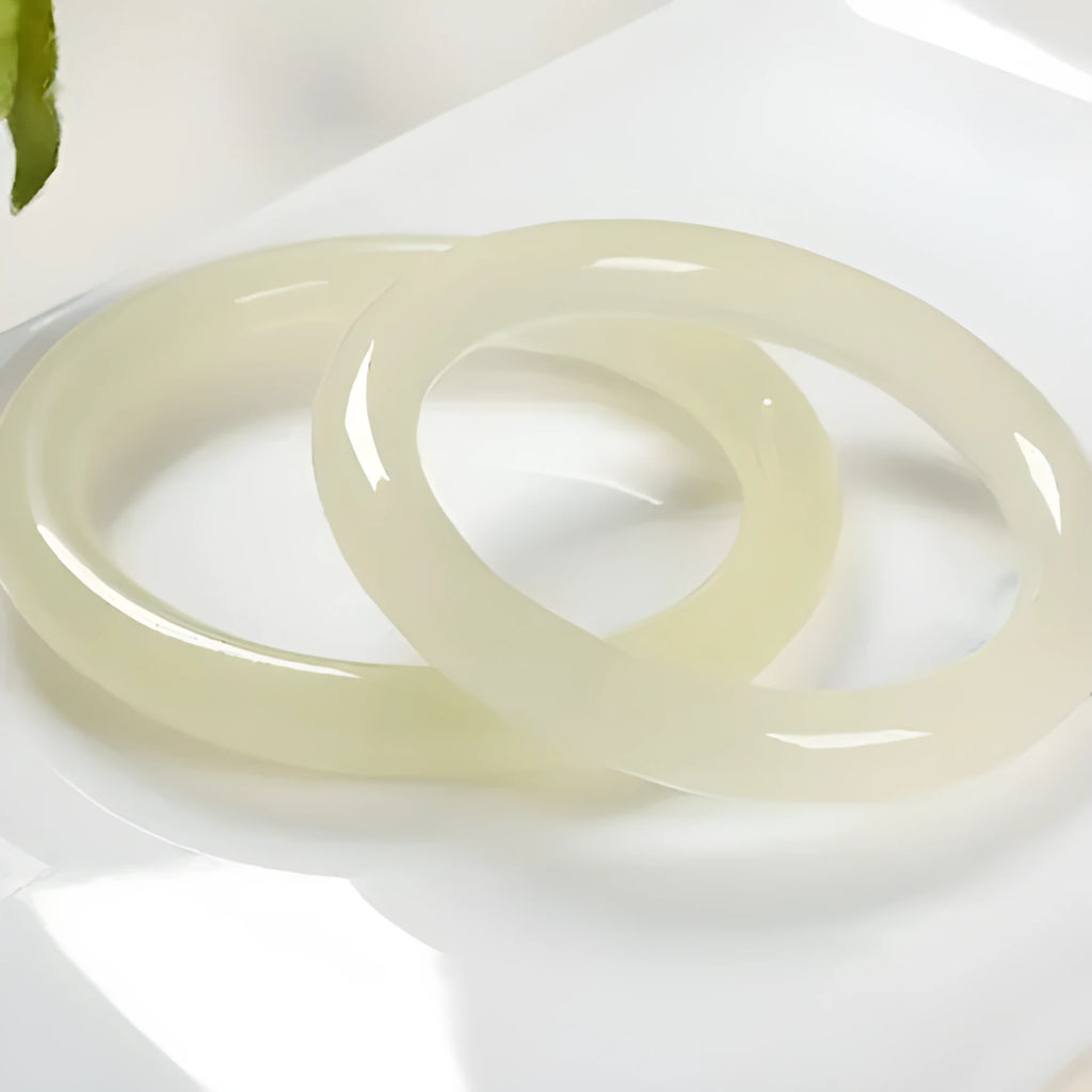 Ice-like silk jade round bar bracelet showing smooth stone surface and circular form