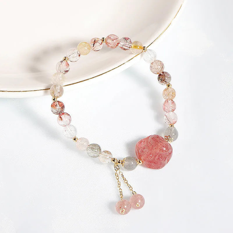 Women's handmade crystal bracelet featuring natural stone with zodiac animal motifs