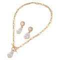 Gold colour baroque pearl pendant necklace and matching stud earrings set.