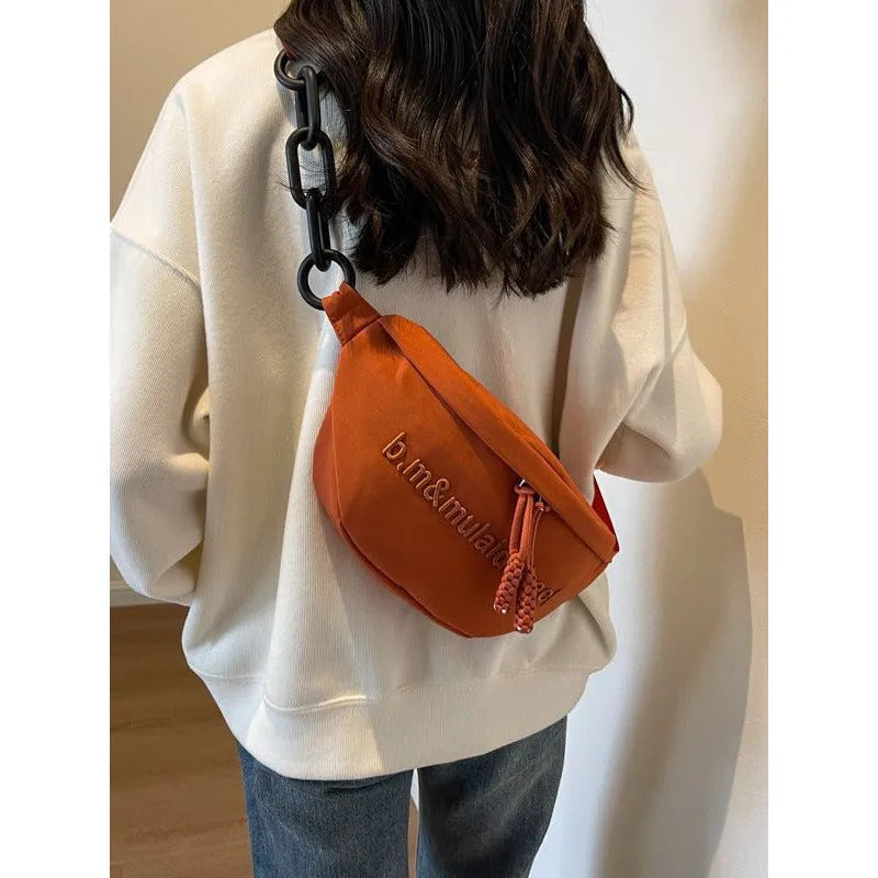 Women's nylon sports shoulder bag in beige with letter and embroidery details and chain accent