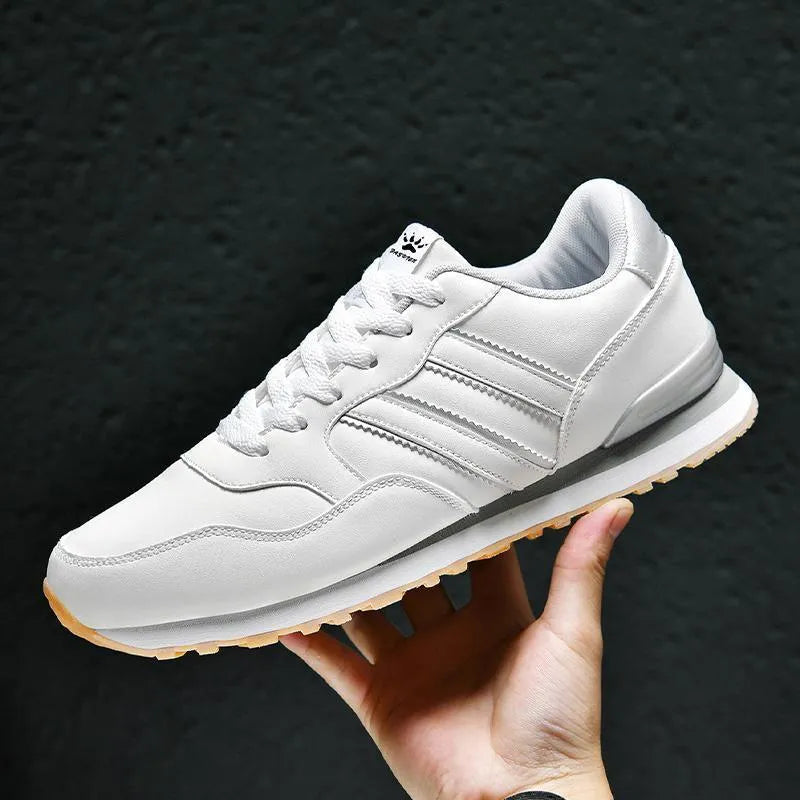 Men's black leather casual sports shoe with carved wing pattern and high heel over 8cm.