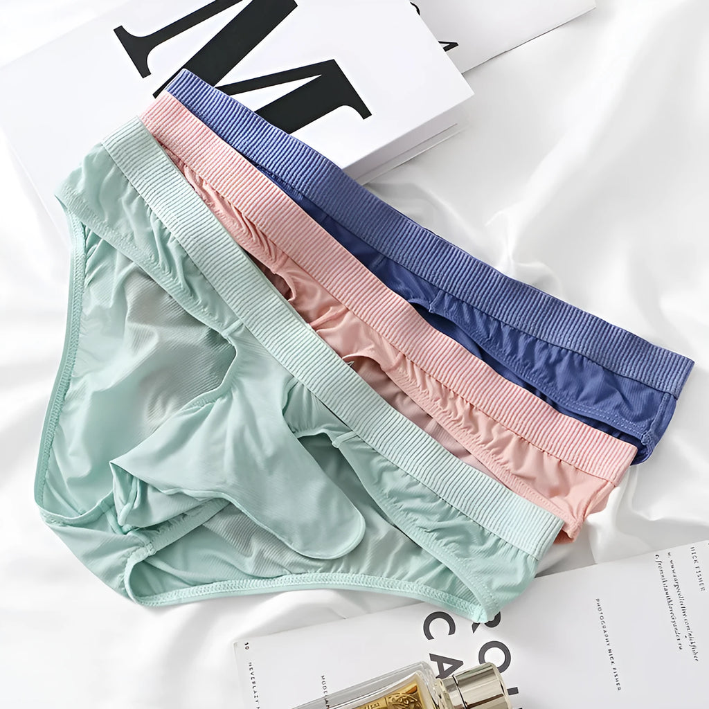 Men's low waist briefs in ice silk nylon fabric shown in multiple colours including black, grey and purplish blue.