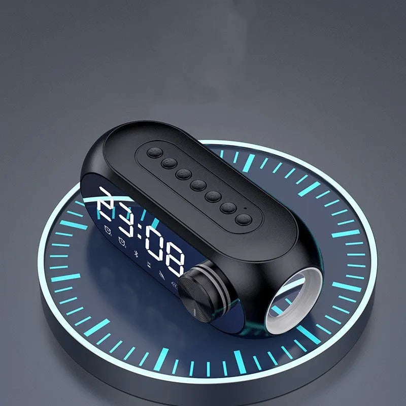 S8 Black Extra Bass portable mini USB speaker on a desk next to a laptop.