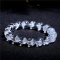 Women's white crystal pyramid bracelet with Ruyi charm showing natural ghost pyramid design