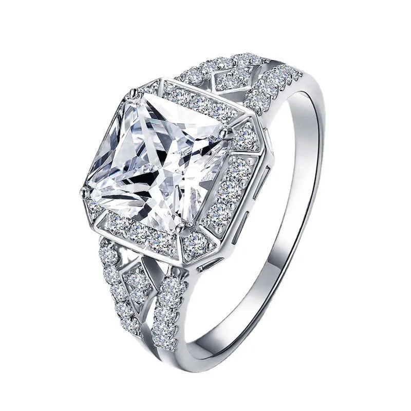 Hollow geometric zircon ring with quadrilateral detailing in platinum colour