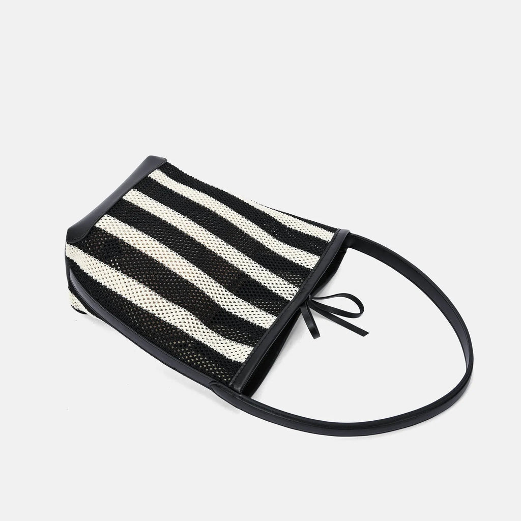 Black and white striped woven fabric women's bucket shoulder bag showing dimensions