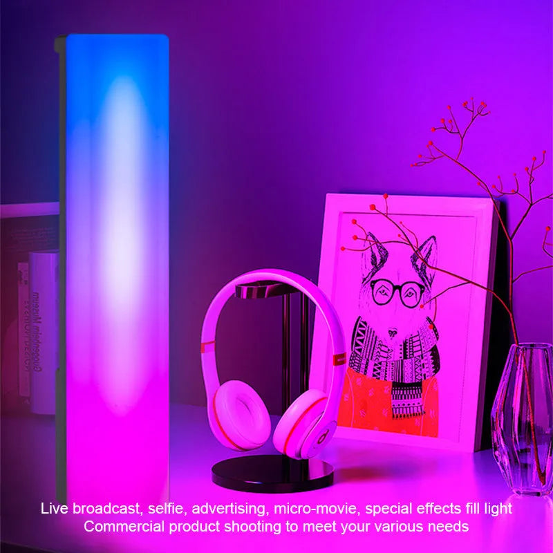 3D RGB voice-activated table lamp with colourful lights on a desk, showing white shell option.