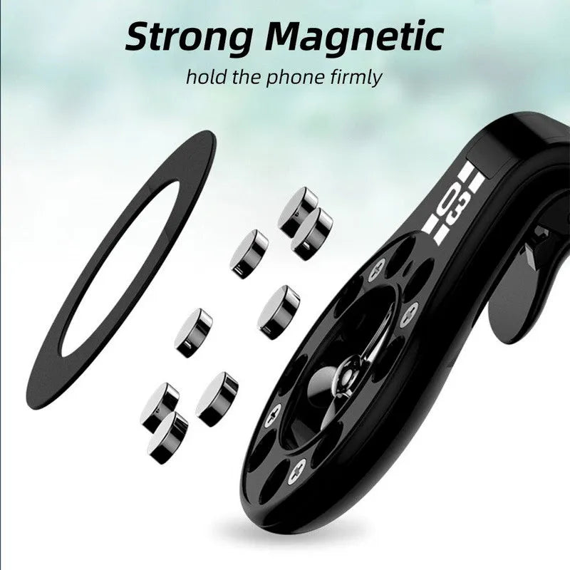 Black magnetic car phone holder clipped to a car air vent, holding a smartphone.