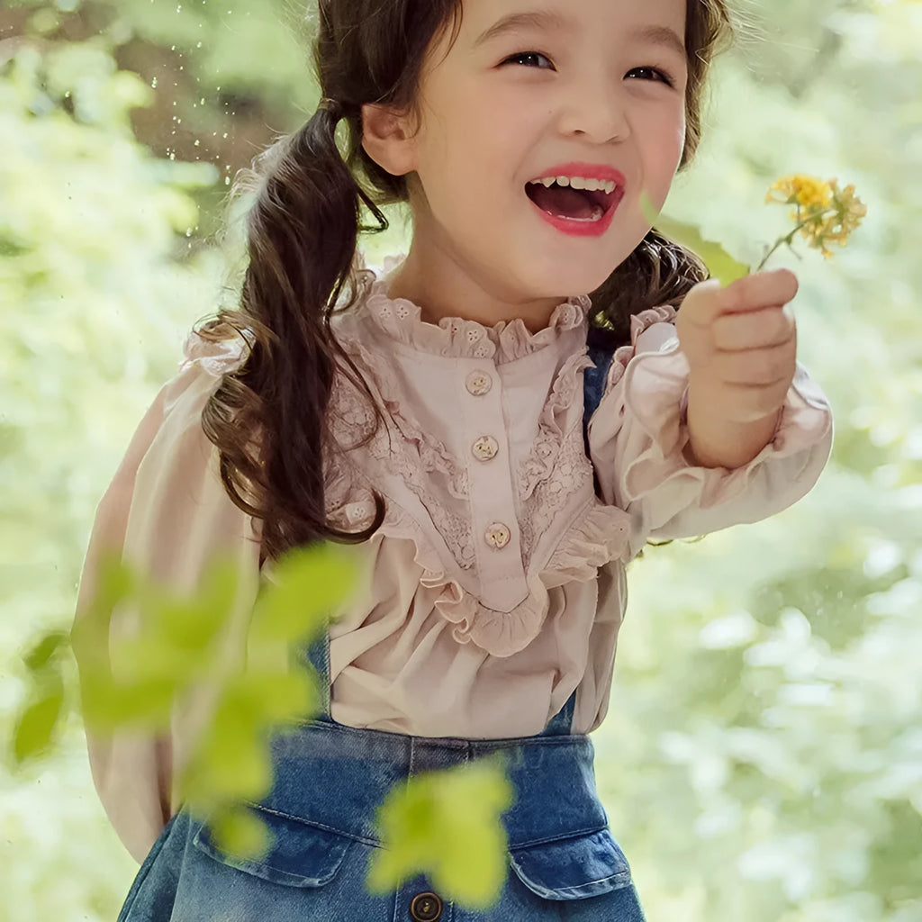 Cotton girls princess shirt with lace collar and long puff sleeves in beige on white background