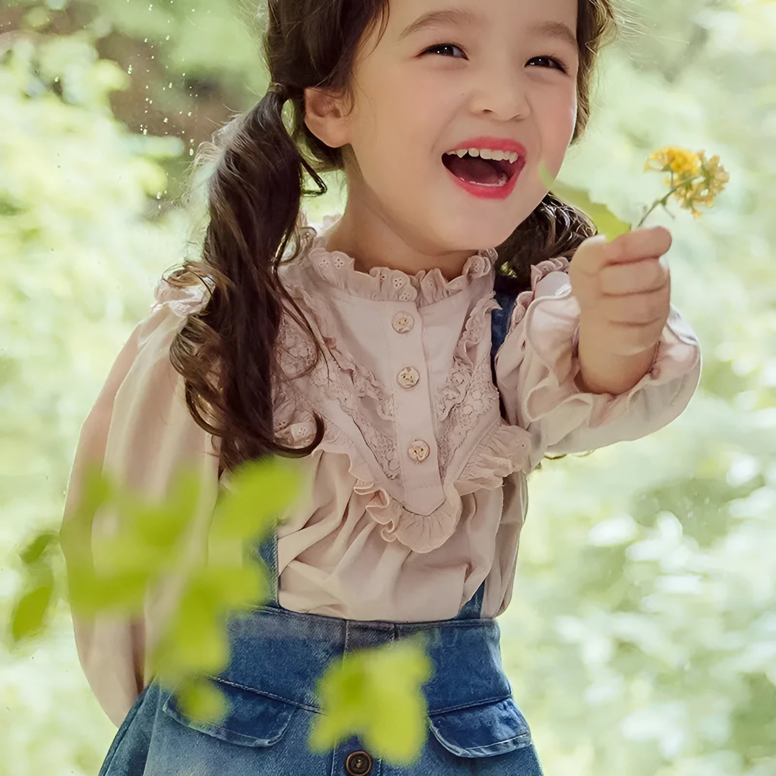 Cotton girls princess shirt with lace collar and long puff sleeves in beige on white background