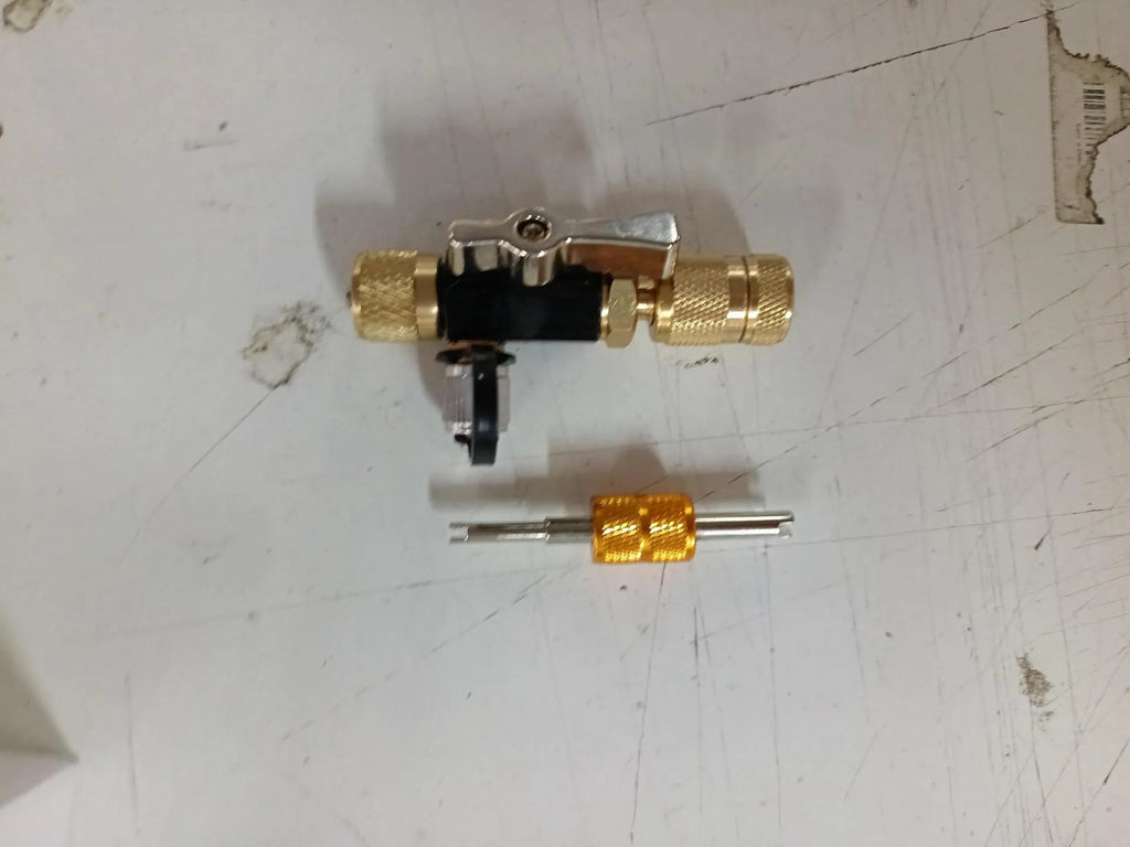 Metal valve core remover tool set showing black and pink tools for 1/4 inch and 5/16 inch vacuum valves.