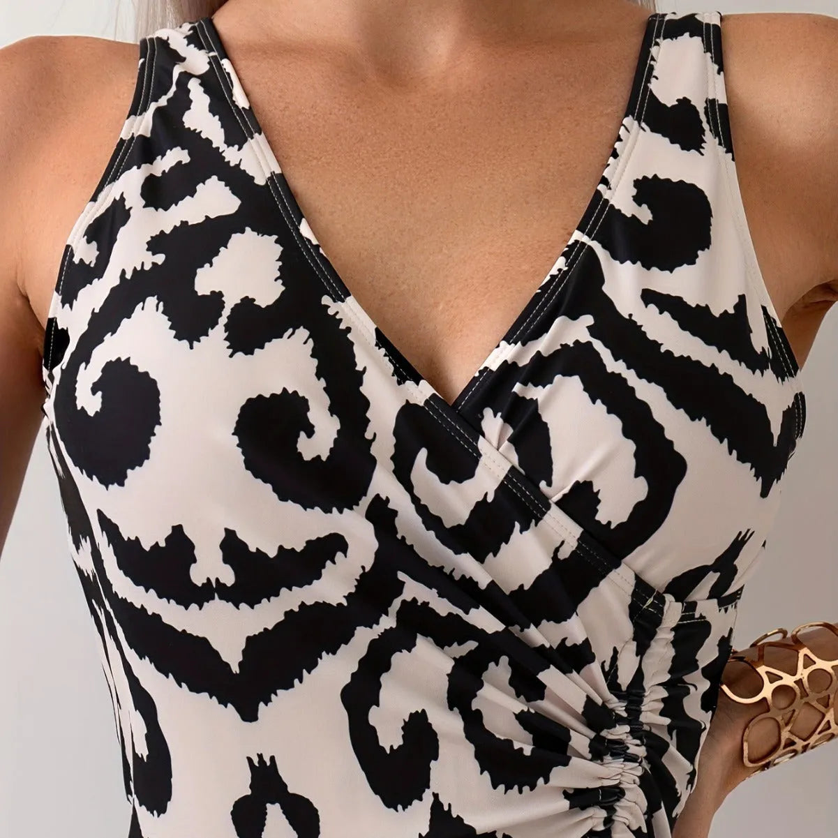 Backless one-piece women's swimsuit with mesh stitching detail in solid colour