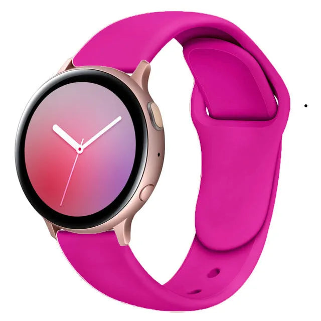 Samsung Galaxy Active 2 watch with a purple reverse buckle silicone strap on a wrist.