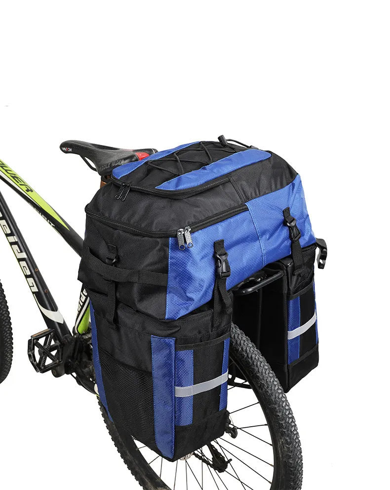 Green 70 litre bicycle rear storage frame bag mounted on a bike for touring.
