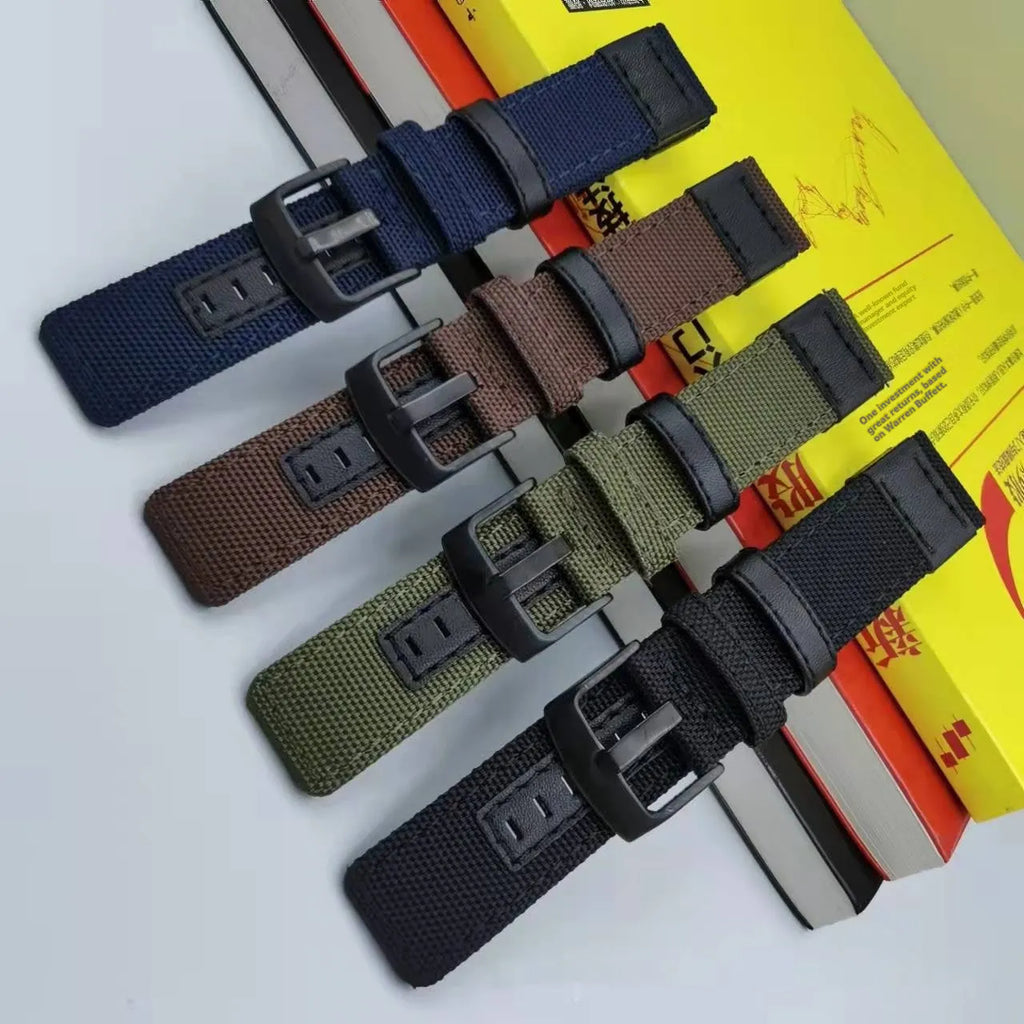 Oxford cloth NATO-style watch strap in army green shown next to black and camouflage colour options.