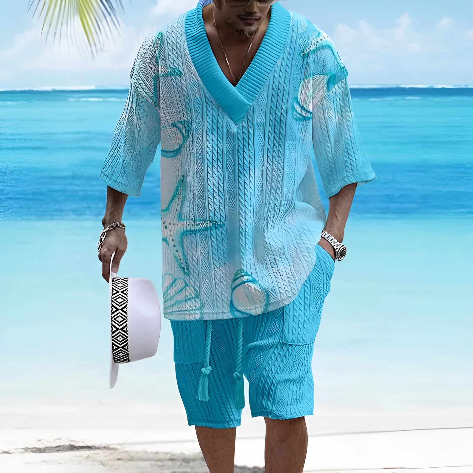 Loose casual short sleeve suit set in a light colour, showing the top and matching shorts laid flat.
