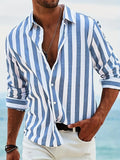 Man wearing a loose-fit yarn-dyed striped long-sleeved casual shirt in light grey.