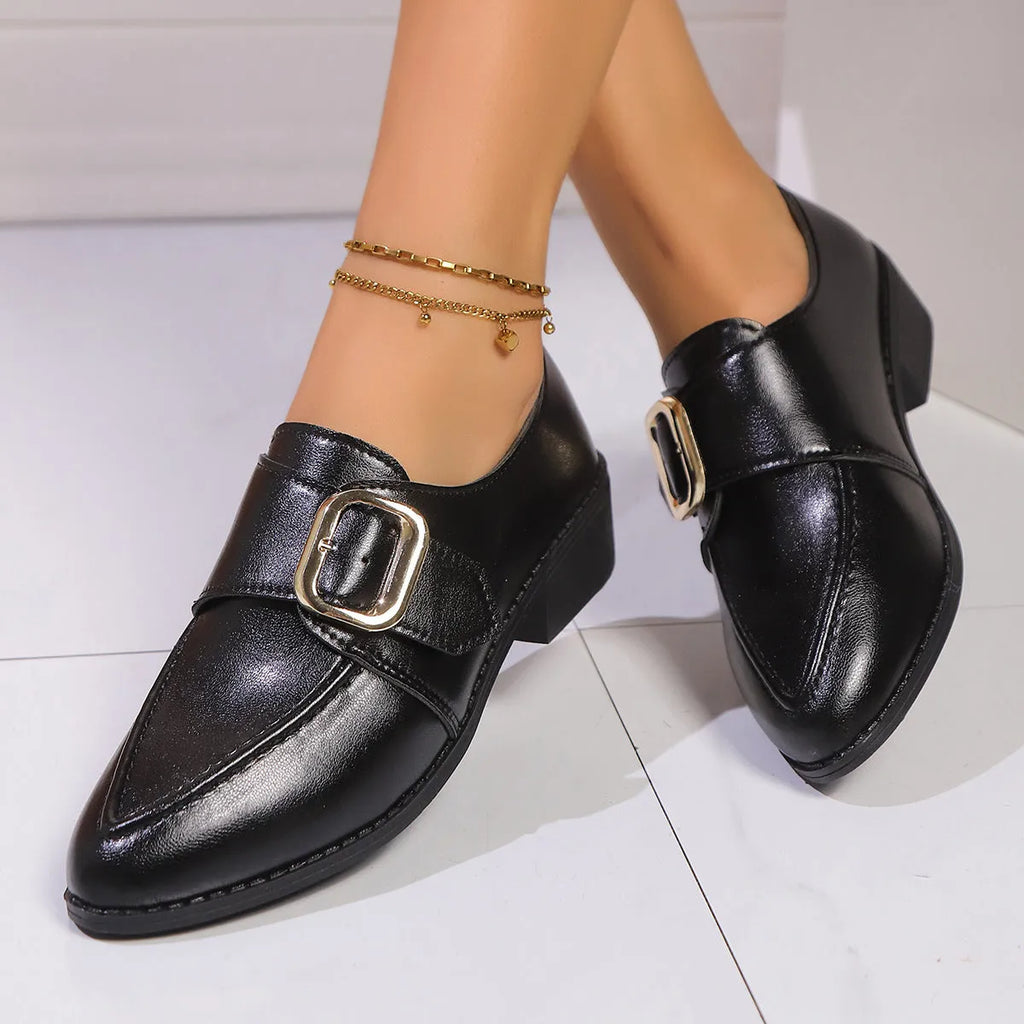 Women's British-style loafers with a bow detail on a PU upper and rubber sole.