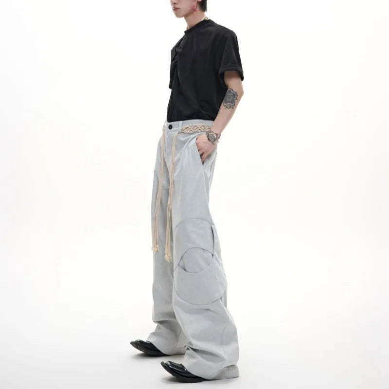 Men's dark blue straight-leg cotton jeans showing front view with zip fly and pocket detailing.