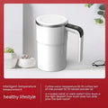 White automatic stirring electric mug with LCD temperature display and USB charging cable