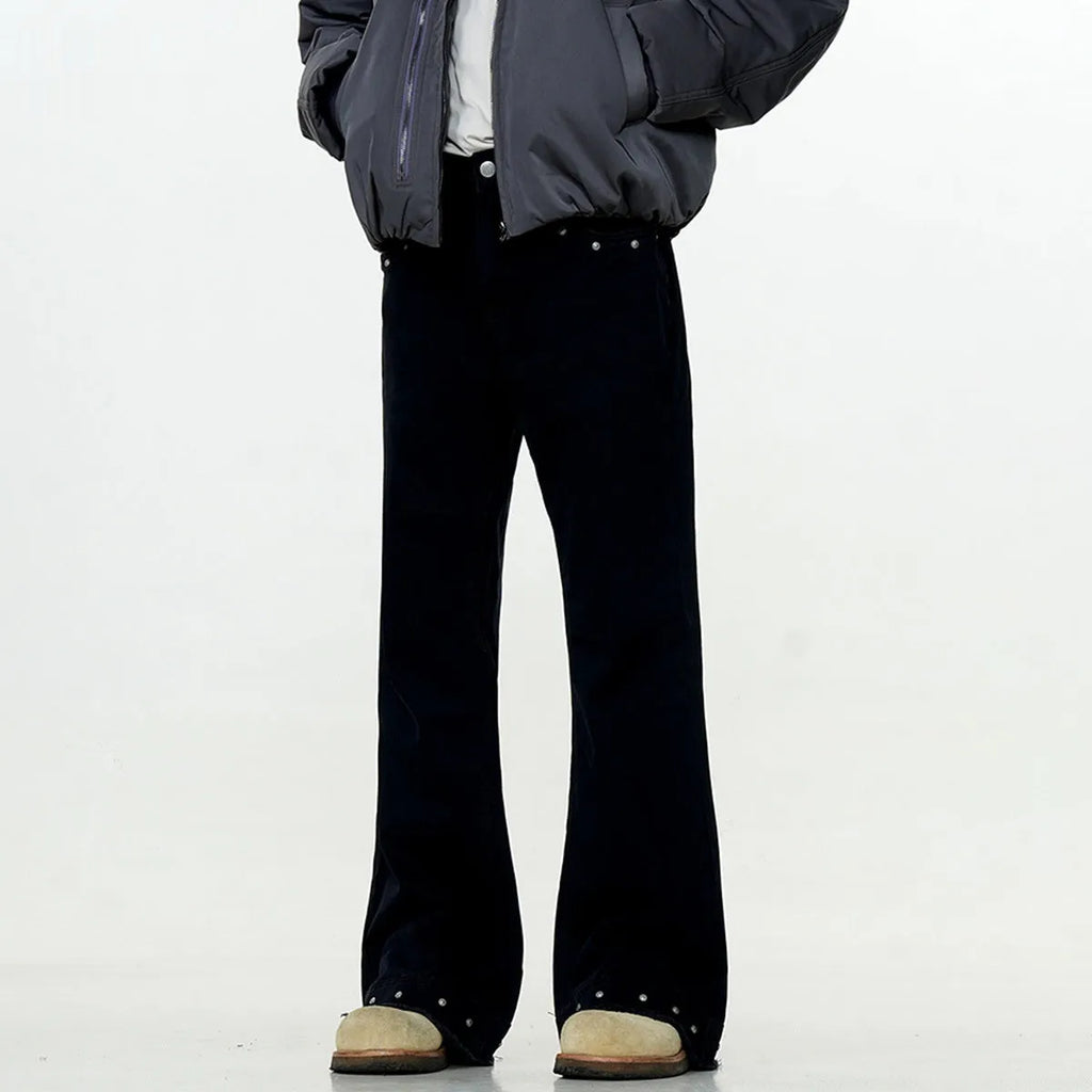American retro straight-leg skinny jeans in black cotton denim laid flat.
