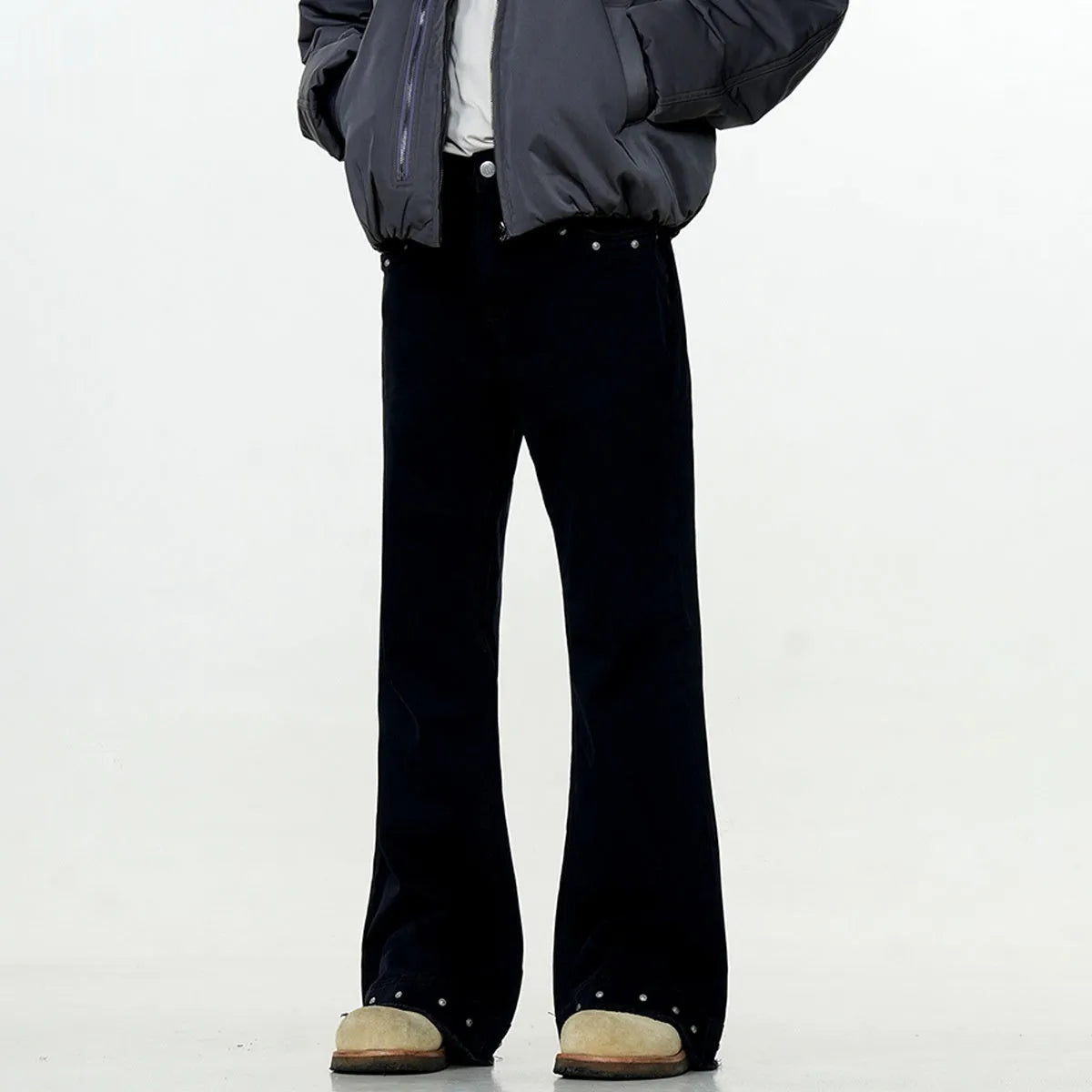 American retro straight-leg skinny jeans in black cotton denim laid flat.