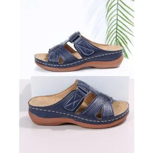 Women's red peep toe wedge sandals with Velcro strap on a fish mouth sole.