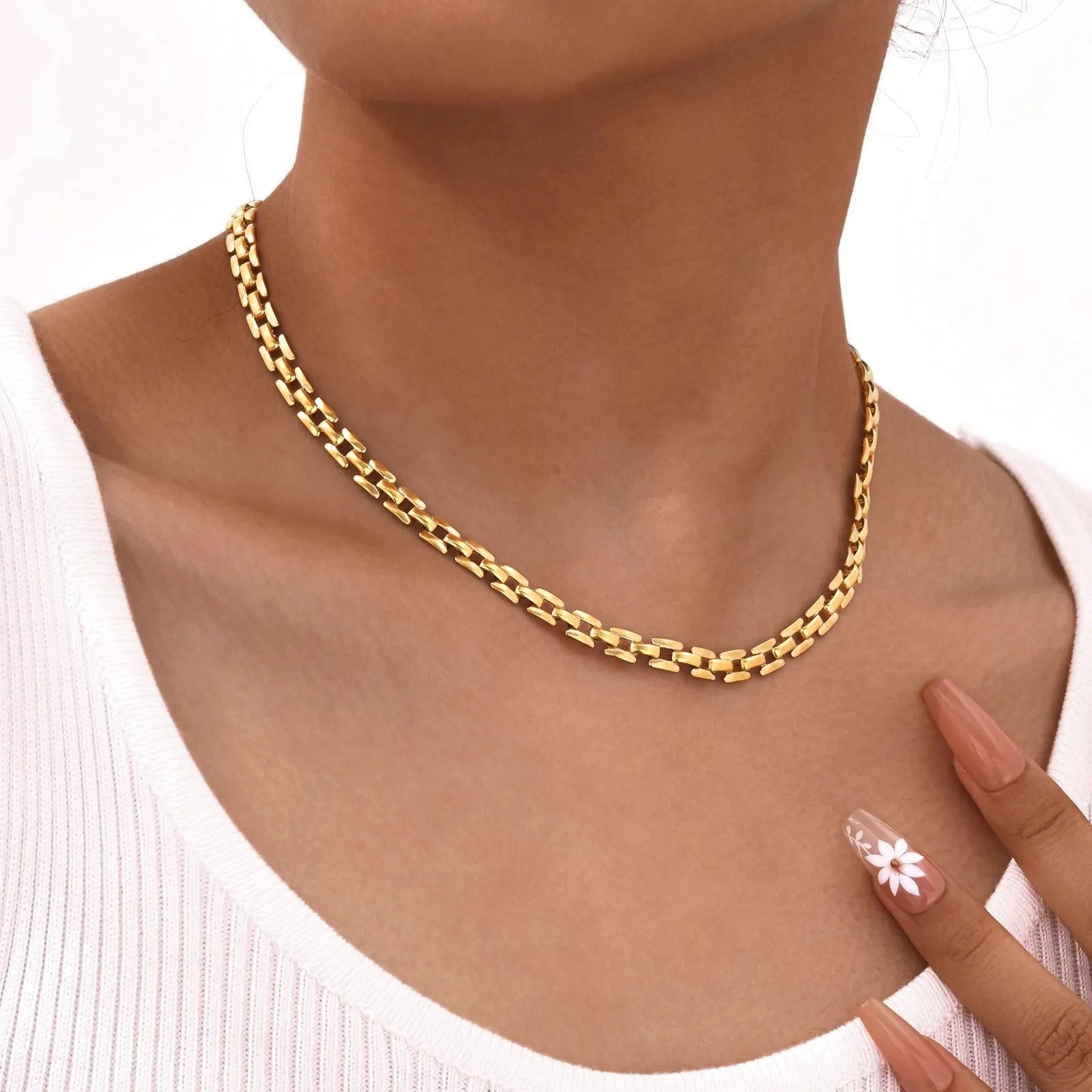 Stainless steel geometric twist necklace on snake bones chain, available in multiple colours