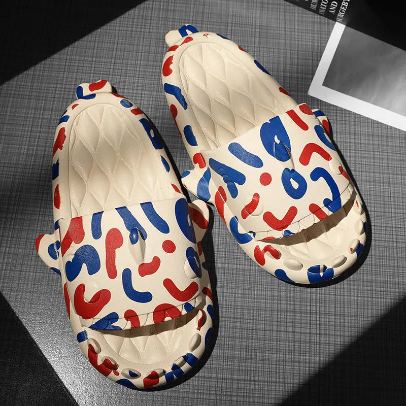 Pair of light beige shark-shaped EVA foam slippers for couples on a wooden floor