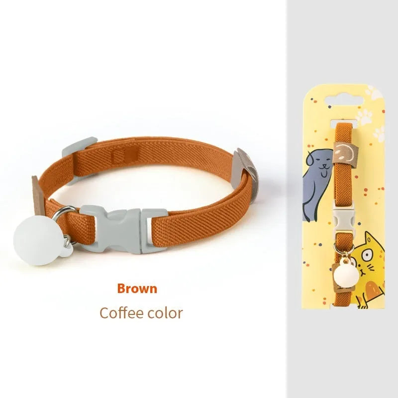 A small, elastic monochrome dog collar in sky blue with a plastic buckle, laid flat.
