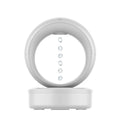White round USB-powered humidifier showing anti-gravity levitating water droplets and mist output.