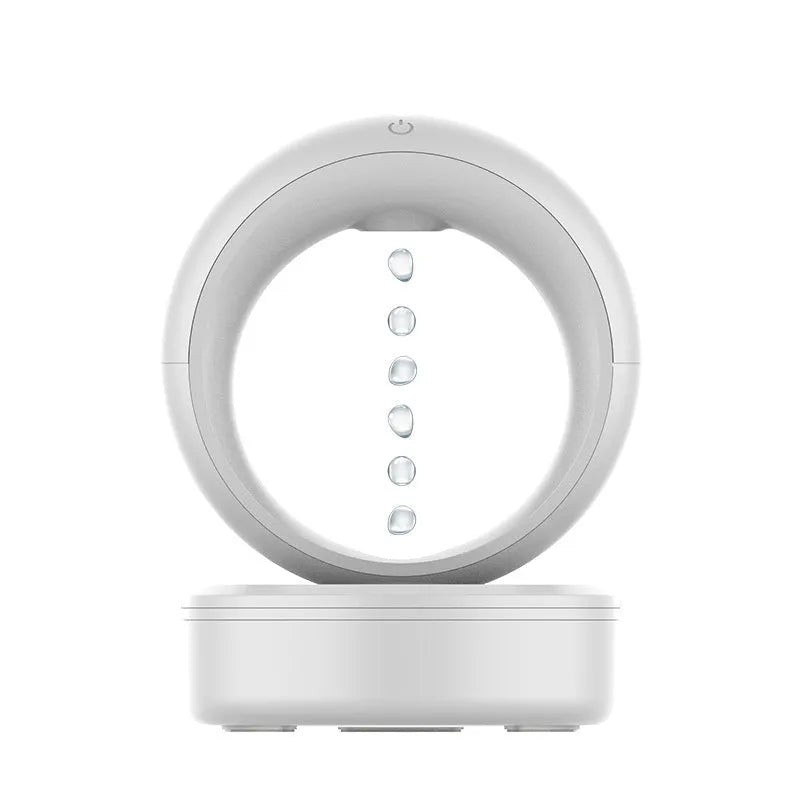 White round USB-powered humidifier showing anti-gravity levitating water droplets and mist output.