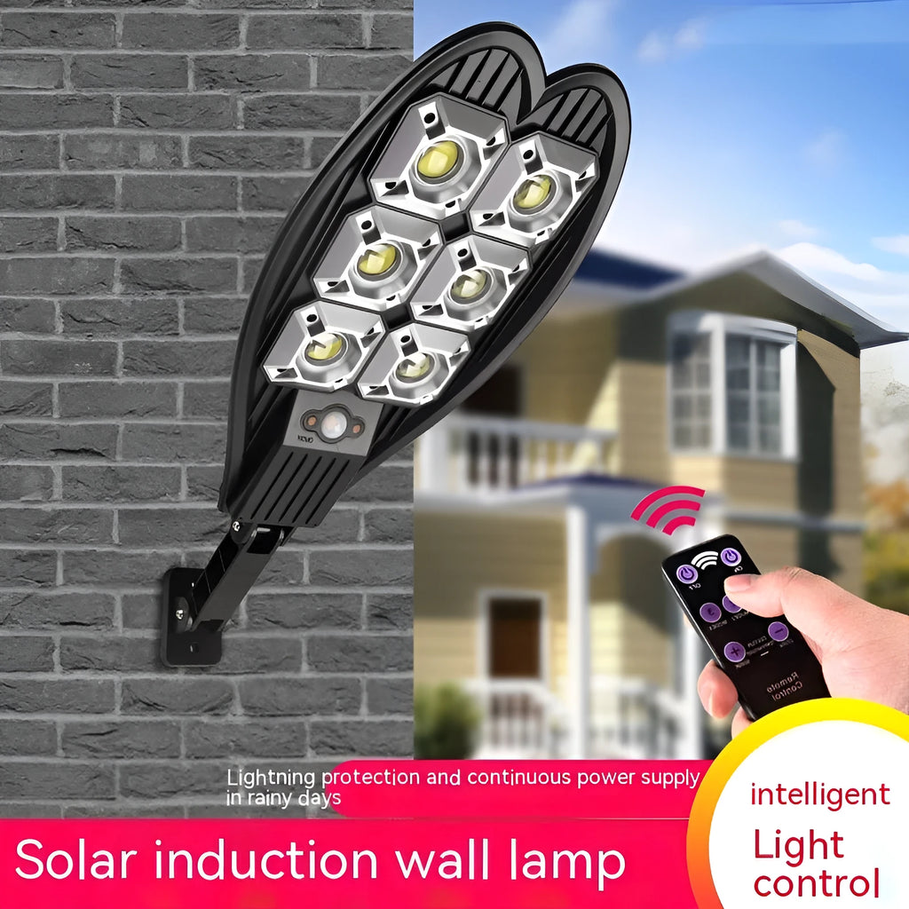 A white 6-eye sword design solar garden lamp with a solar panel on top, shown with its remote control.