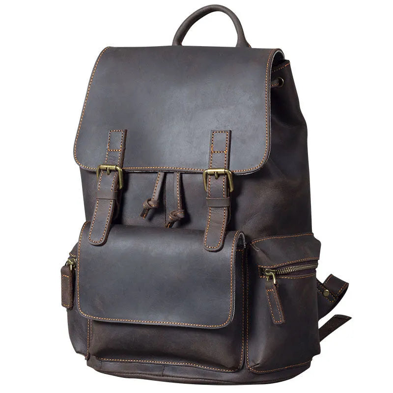 Brown crazy horse leather backpack with denim lining and double shoulder straps.
