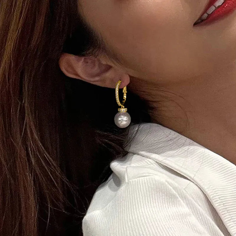 Yellow gold copper earrings with imitation pearl and inlaid zircon in geometric round shape