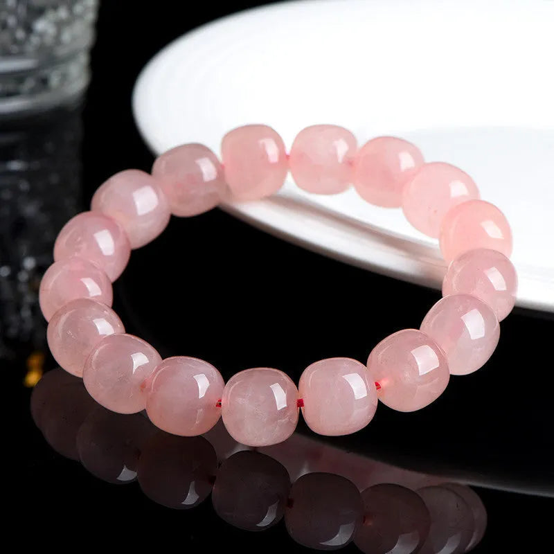 Pink crystal barrel bead bracelet with 8x10mm geometry-shaped stones on wrist