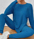 Black sunken stripe two-piece loungewear set with top and trousers on a hanger.