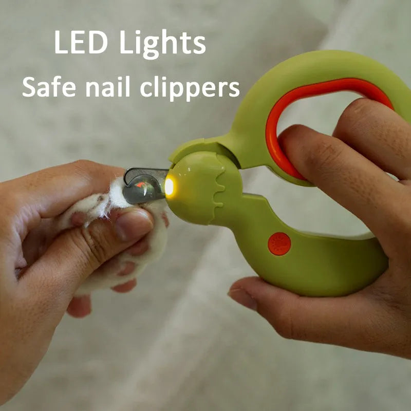 Blue pet nail clippers with LED light on, showing ergonomic non-slip handles and stainless steel cutting blades