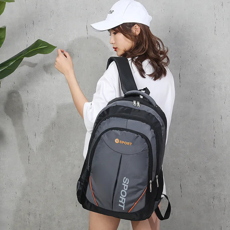 Large capacity men's backpack in black colour with curved shoulder straps and letter detailing