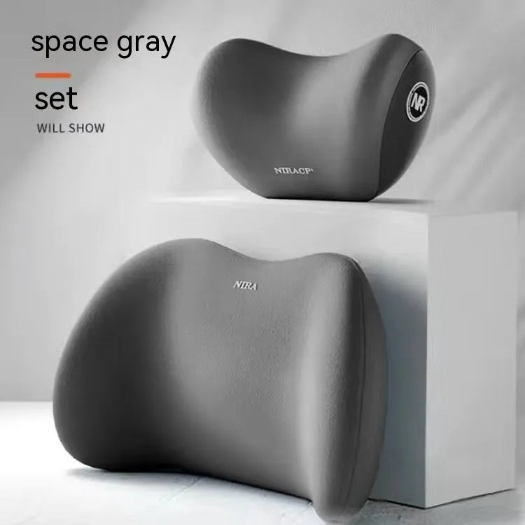 Black memory foam car headrest pillow and matching lumbar support pillow on a car seat.