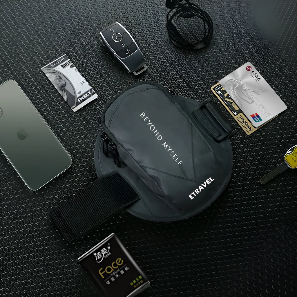 Black reflective running arm bag with adjustable strap, shown holding a large smartphone.