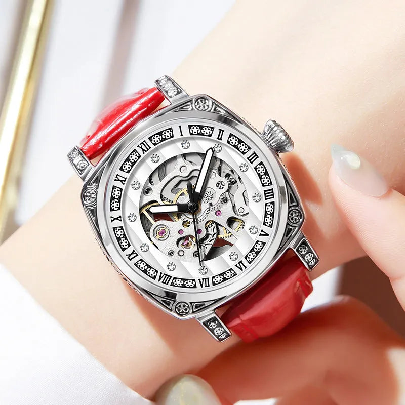 Mechanical watch with luminous hands and a leather strap on a wrist, showing black case variant.