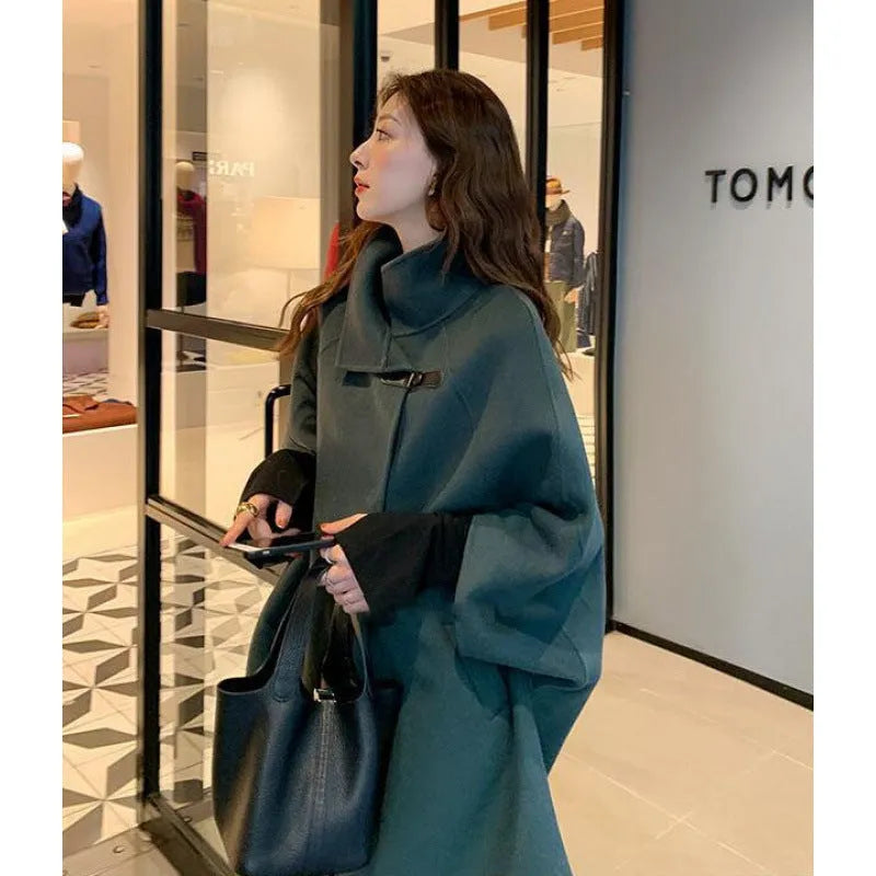 Women's oatmeal coloured acrylic coat with flight sleeves and a long 100cm length.