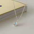 Silver geometric pendant necklace on a curb chain with adjustable length 41-50cm.