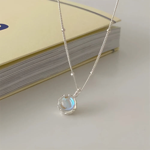 Silver geometric pendant necklace on a curb chain with adjustable length 41-50cm.