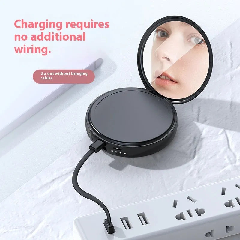 Small portable power bank with USB charging and built-in data cable in white plastic shell