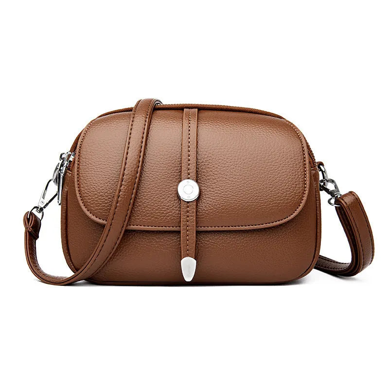 City Simple women's oval crossbody shoulder bag in soft PU leather with sewing thread details