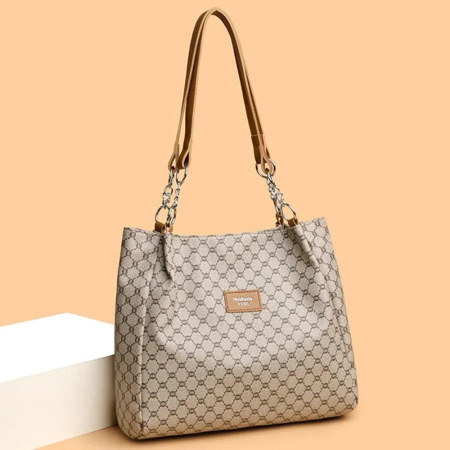 Retro women's handbag in soft brown PU leather with polyester lining.