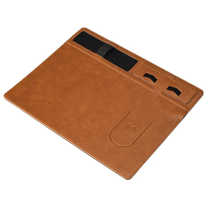 Pink PU leather mouse pad with wireless charging spot and an upright phone in the holder