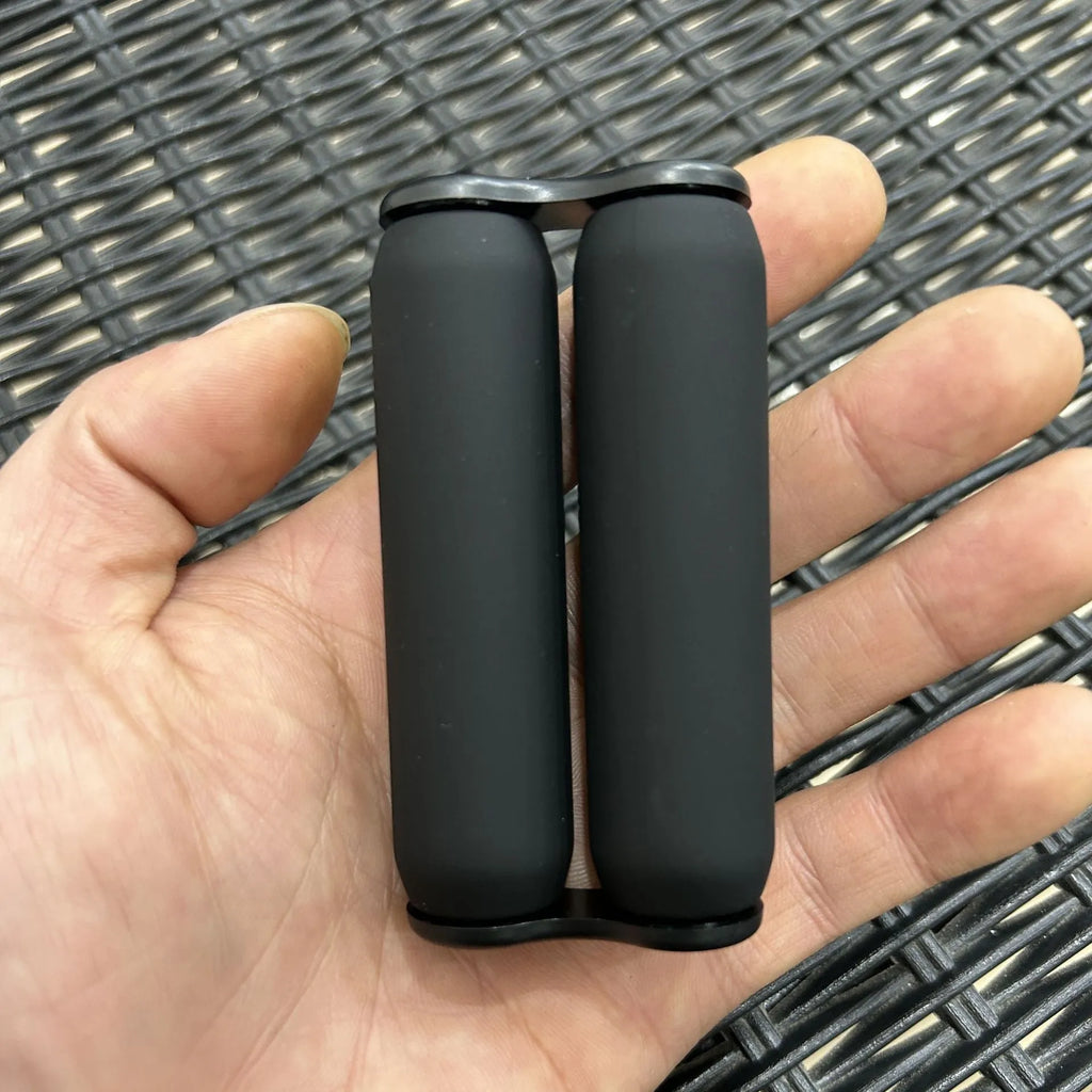 Silicone decompression roller palm massage toy in black common style on a plain background